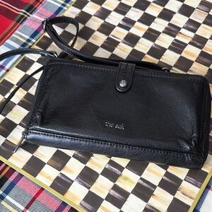 The Sak Black Leather Wristlet crossbody